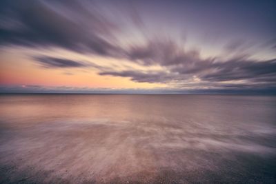 Scenic view of sea against sky at sunset