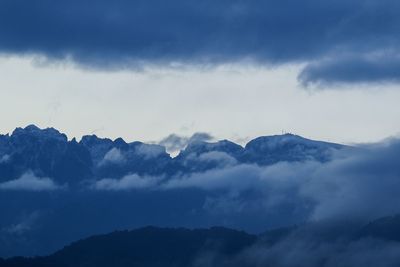 Low angle view of majestic mountains against sky