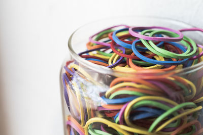 High angle view of multi colored glass jar on table