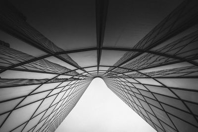 Low angle view of suspension bridge against sky