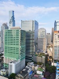 Modern buildings in city against sky