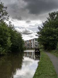 River amidst trees against sky