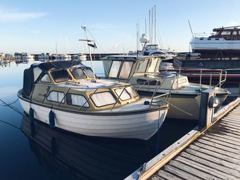 Boats moored at harbor