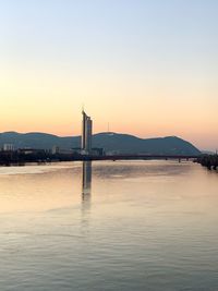 View of bay against sky during sunset