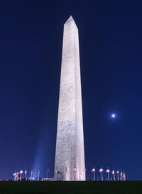 Low angle view of monument at night