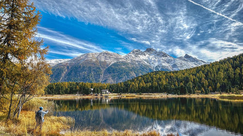 Scenic view of lake and mountains against sky