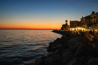Scenic view of sea against sky during sunset