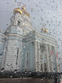 Full frame shot of wet glass window in rainy season