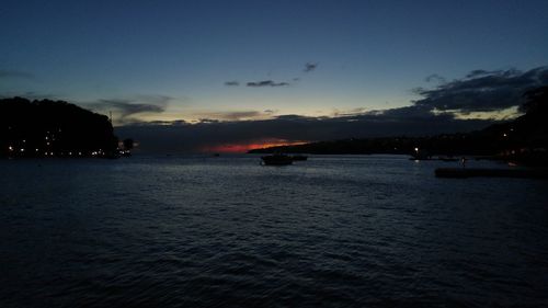 Scenic view of sea against sky at dusk