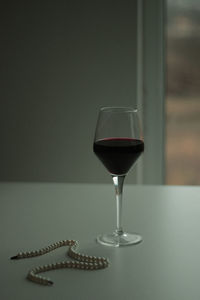 Close-up of wine in glass on table