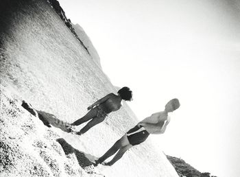 Low angle view of man against clear sky