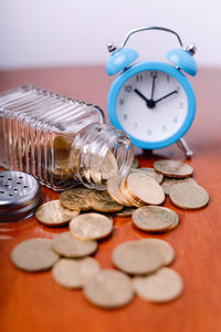 Close-up of clock on table tax concept