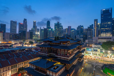 High angle view of illuminated buildings in city against sky