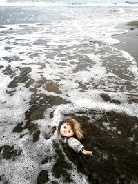 High angle view portrait of girl on beach
