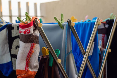 Close-up of clothes hanging on rack