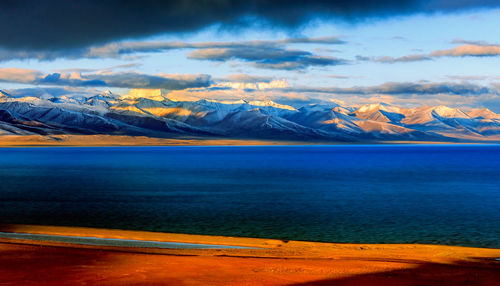 Scenic view of sea against cloudy sky