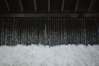 Close-up of snow on sea shore
