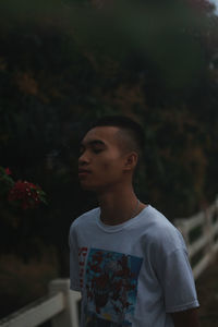 Young man standing outdoors