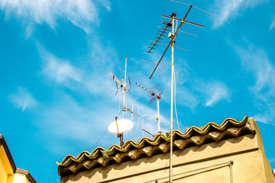 Low angle view of roof and building against sky