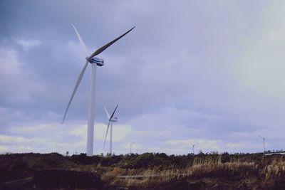 Wind turbines in field