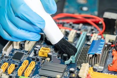 Midsection of man working in factory