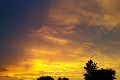 Low angle view of dramatic sky during sunset