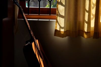 Close-up of guitar at home