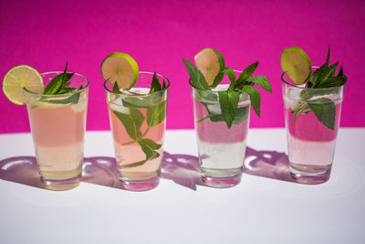 Close-up of four glasses of mojito