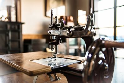 Close-up of sewing machine at home