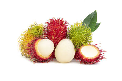 Close-up of fruits against white background