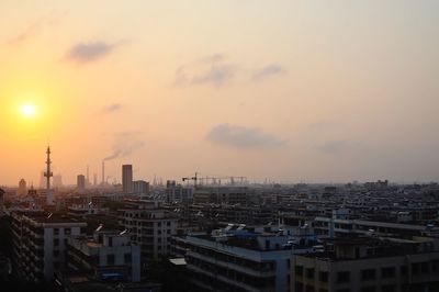 High angle view of city at sunset