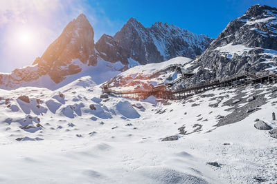 Scenic view of snowcapped mountains against sky