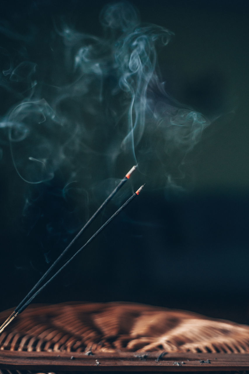 CLOSE-UP OF SMOKE EMITTING FROM AIRPLANE