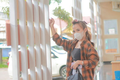Side view of young woman looking away