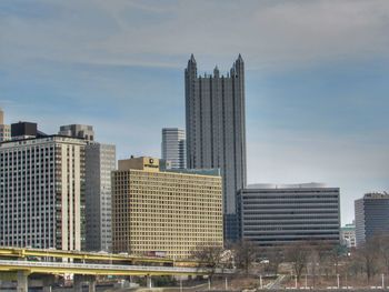 Modern buildings in city against sky