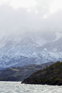 Scenic view of mountains and sea against sky