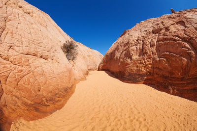 Rock formations in desert against clear sky