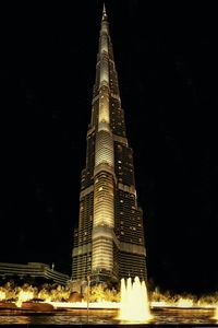 Low angle view of illuminated city at night