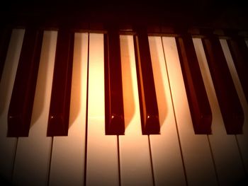 Close-up of piano in the dark