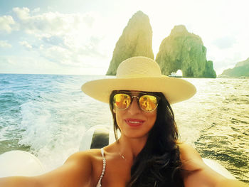 Portrait of smiling woman in sea