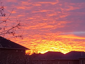 Scenic view of mountains against orange sky