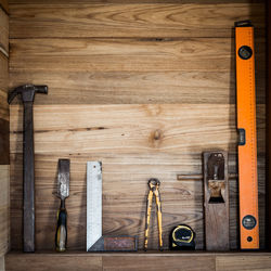 Work tools on wooden shelf