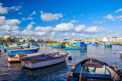 Boats moored at harbor