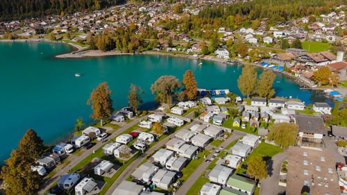 High angle view of trees by lake