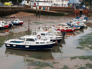 High angle view of boats moored at harbor