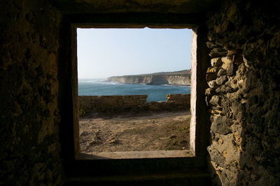 View of sea through window