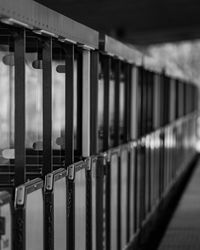 Close-up of metal fence against building