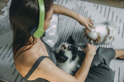Side view of woman with dog