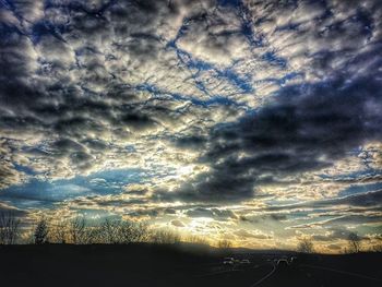 Scenic view of landscape against cloudy sky