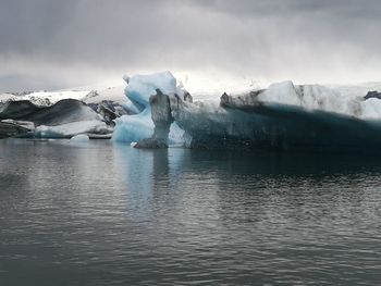 Scenic view of frozen lake against sky